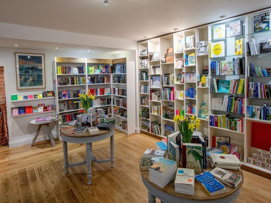 The wider room at The Little Ripon Bookshop, with an exposed-brick archway through to the childrens room
